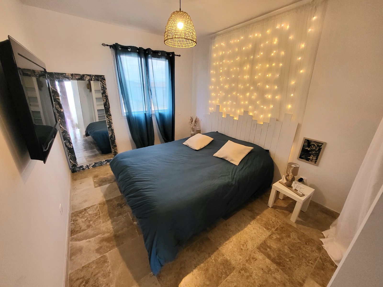 Blue bedroom with fairy lights