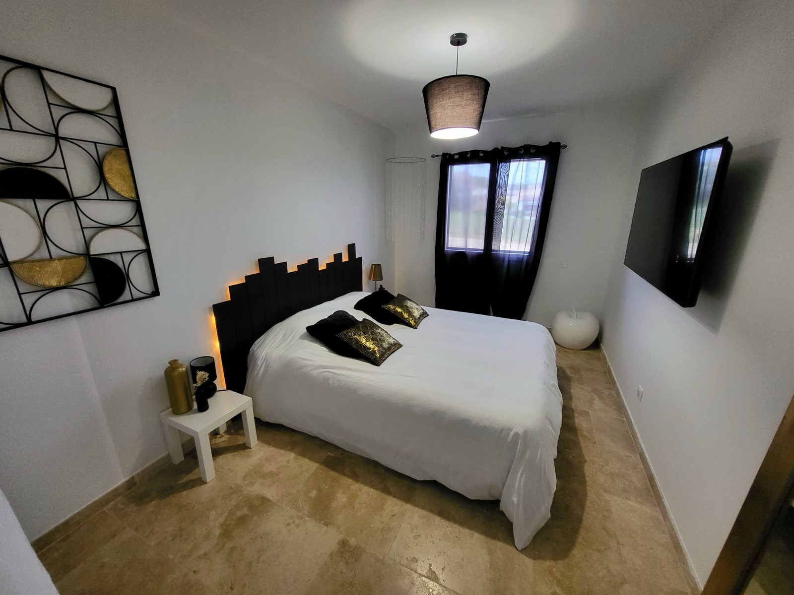 Bedroom with black and gold decor